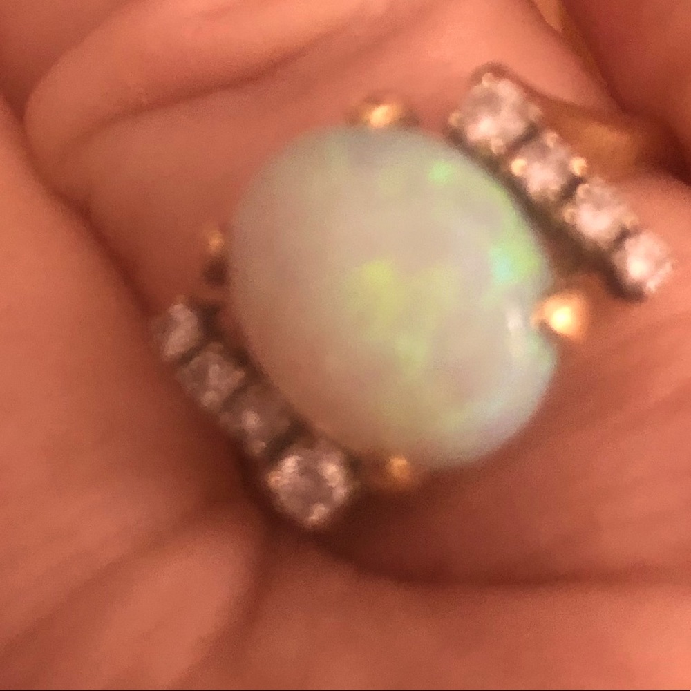 Opal ring with six small diamonds